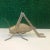 Vintage oversized brass grasshopper figure with moving legs.
