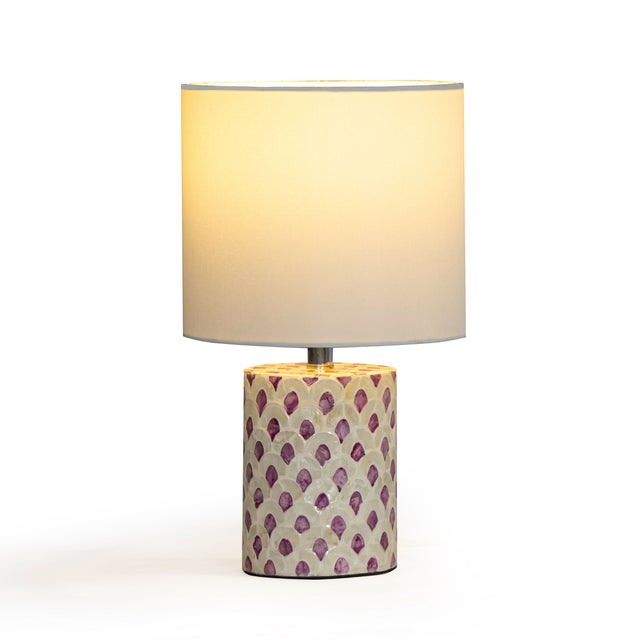 The Merlot Capiz Shell Table Lamp brings a touch of luminous elegance to any space. Hand-placed Capiz shells shimmer...
