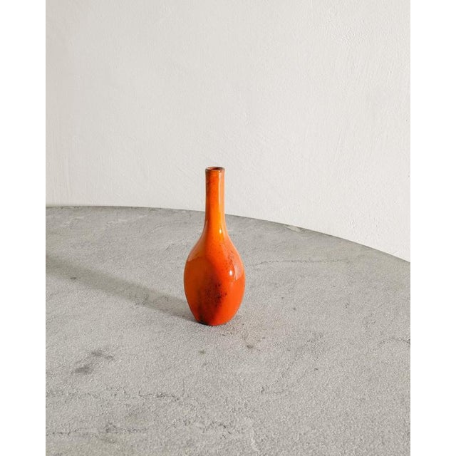 Rare French mid century ceramic bottle vase with a warm red glaze by an anonymous designer attributed to Jacques & Dani...