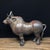 This is a striking vintage Chinese bronze figure of a rhinoceros, known as a "Xiniu" (犀牛). The animal stands foursquare on...