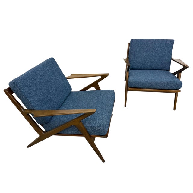 Elevate your living space with this exceptional pair of Mid-Century Danish Modern “Z” arm chairs designed by Poul Jensen...
