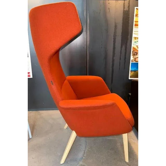 Luxurious and tall wing-back chair with acoustical panels to give a more private feel. This seat is perfect for break-out...