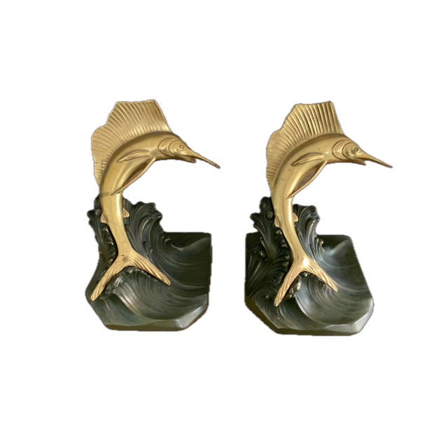 These bookends, likely from the 1930's Art Deco era, feature a popular nautical theme often associated with Jennings...