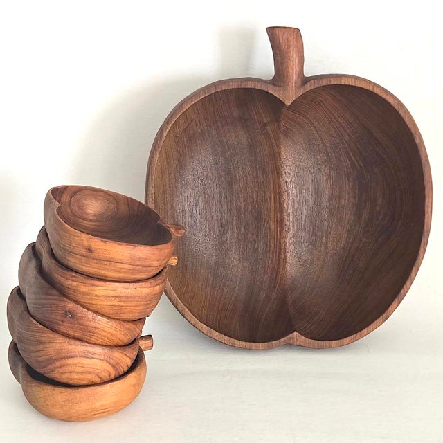 Offered is a set of 6 mid 20th century hand carved teak wood bowls shaped like apples. It includes 1 large serving bowl,...