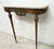 Louis xvi style wall console in chased bronze apron decorated with garlands and foliage two tapered legs with recessed...