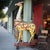 Striking vintage large Indian festival giraffe sculpture, hand-carved from wood and presented on a wheeled wooden...