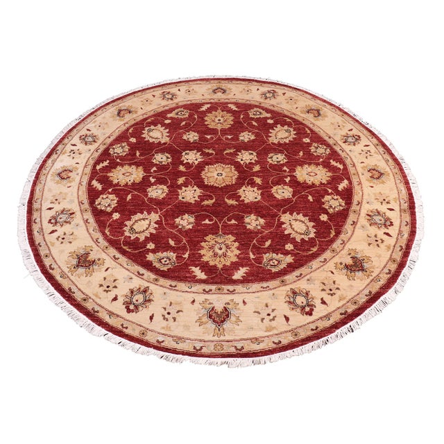 Transform your space with the Kafkaz Chobi Peshawar Round Hand‑Knotted Wool Rug, crafted by skilled Turkish artisans using...