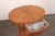 A French Empire style oval side table, with brass accents, from the turn of the 19th and 20th century. This antique table...