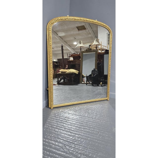 A very good English egg and dart arched top overmantle mirror, with original mercury mirror and panelled back, in very...