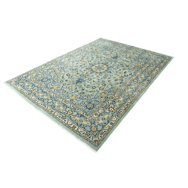 A true masterpiece of traditional knotting art: This hand-knotted Kashmar oriental rug in a rare pistachio green color...