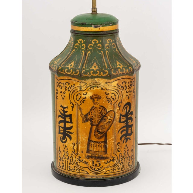 Victorian Chinoiserie Green Painted Toleware Lamp, with gilt and painted figural and character scene to the front with...