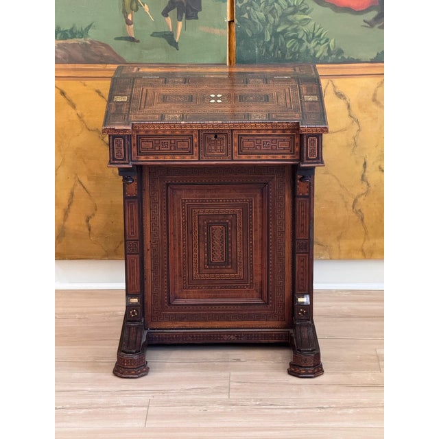 Geometric marquetry covers nearly every surface of this Middle Eastern (possibly Syrian) davenport desk, with Greek key...