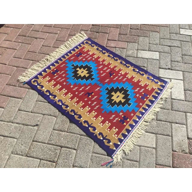 This beautiful, vintage, handwoven kilim is approximately 60 years old. It is handmade, of very fine quality hand spun...