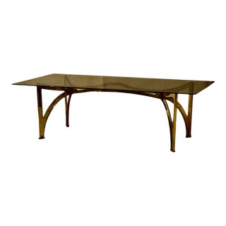 Retired Cb2 Indoor-Outdoor Brass & Smoked Glass Dining Table For Sale
