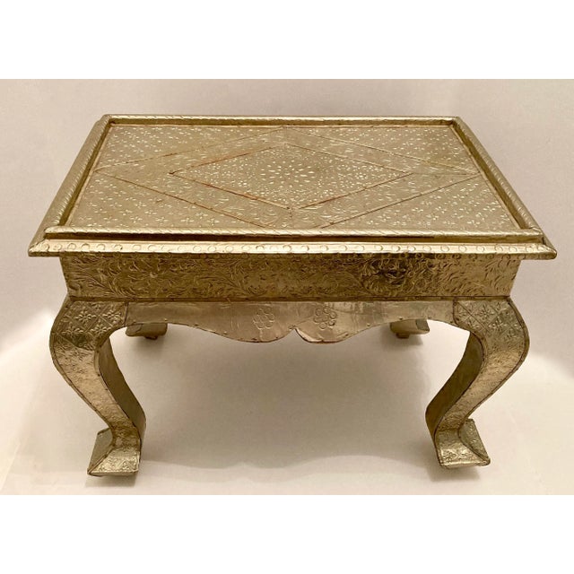 Mid 20th century hand embossed brass clad low side table. Decorative small table engraved with floral patterns. Good...