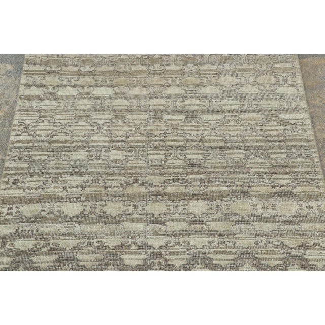 Made with hand-knotted natural silk, this 3x9 runner rug is a sophisticated addition to Rug & Kilim’s Block Print...