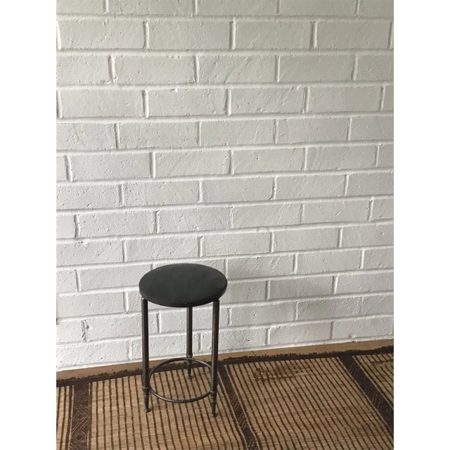 This vintage Parisian brass metal stool has timeless elegance. The stool features a pitted brass metal base with a...