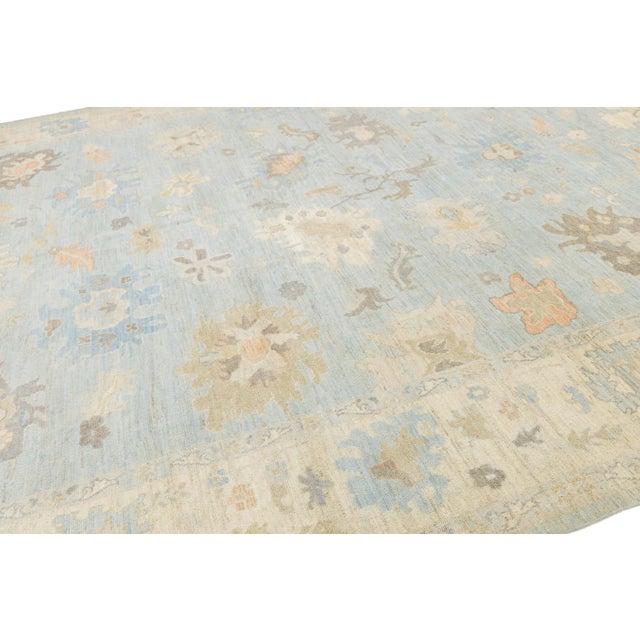 Elevate your interior with this stunning Modern Oushak Style Wool Rug, a perfect blend of timeless Turkish tradition and...