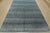 This fine contemporary area rug is hand-knotted with an all-wool pile on a cotton foundation. This rug is new and in...