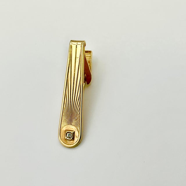 This is a dramatic Tie Clip from the 1950s. We have curated a collection of Mid-Century Cuff Links and Tie Clip Tacks that...