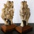 A highly decorative and finely carved pair of 19th-century stone sculptures depicting elegantly robed female figures...