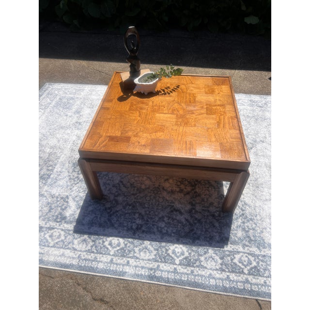 A beautifully restored vintage Lane Furniture parquet oak coffee table in warm honey tones. The parquet top features...