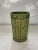 Antique round pottery umbrella stand with relief decoration and green glaze finish.