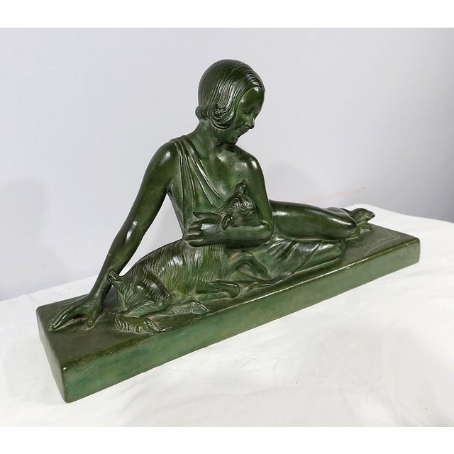 Art Deco Sculpture of La Demoiselle et le Chevreau by A. Godard, Early 1900s, in Very Good conditions. Designed 1890 to...