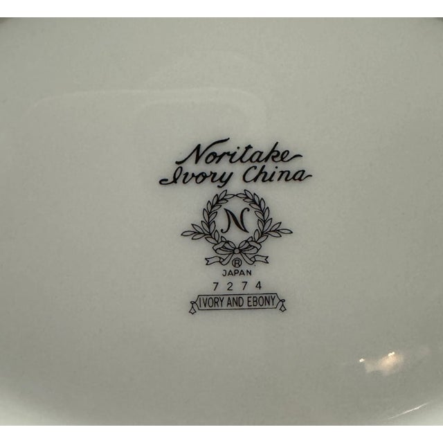 This set is a beauty and comprises of ivory China with gold rings and a black band symbolizes true elegance - its classy...