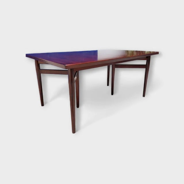 Large dining table designed by Arne Vodder in 1960 and produced by Sibast Furniture, Denmark. The dining table is in...