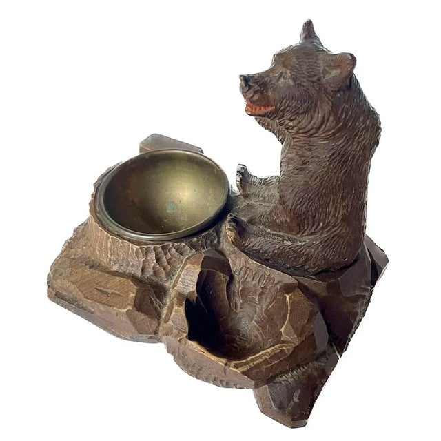 Antique Black Forest carved bear inkwell with brass dish insert. Depicts a carved bear figurine. No maker's marks. Brass...