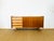 Vintage Scandinavian teak sideboard dating from the 1960s, featuring two storage doors with shelves and four drawers....