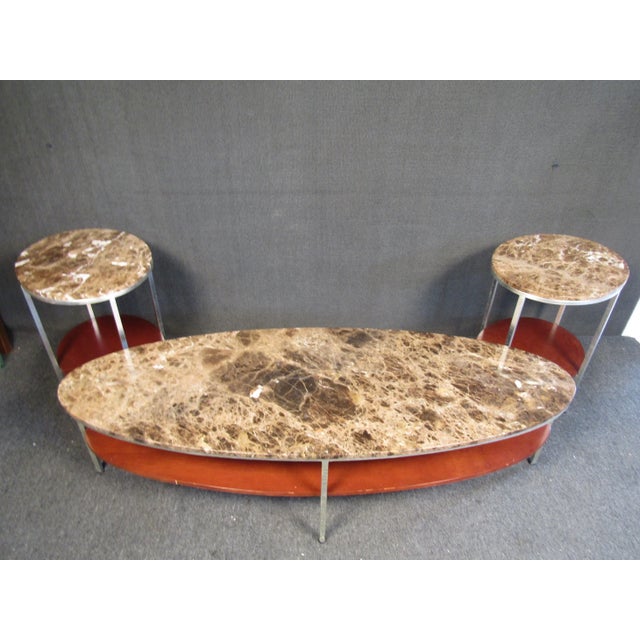 Vintage modern marble and metal coffee table set. This sleek set includes ( 1 ) large oval shaped marble table and ( 2 )...