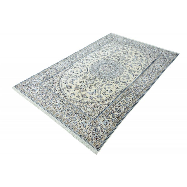 This high-quality Nain 9La rug, measuring 311 x 200 cm, is an artfully crafted masterpiece of traditional knotting. The...
