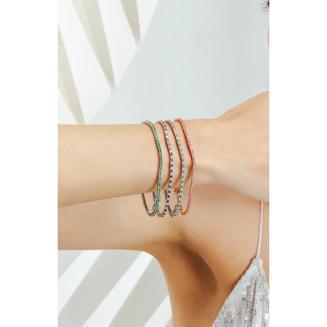 This is part of Chairish’s Fine Jewelry assortment. This Natural Sleek Blue Sapphire and Diamond Tennis Bracelet in 18K...