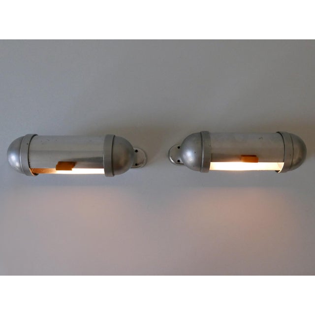 Set of two elegant and minimalistic streamlined design sub-marine cabinet / u-boot sconces or wall fixtures by könig,...