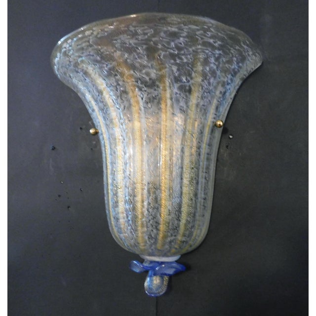 Italian wall light with a Murano glass shield hand blown with granular texture and infused with gold flecks including a...