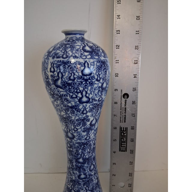 Add timeless elegance to your décor with this beautiful vintage Chinoiserie ceramic vase. Featuring a classic blue and...