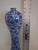 Add timeless elegance to your décor with this beautiful vintage Chinoiserie ceramic vase. Featuring a classic blue and...