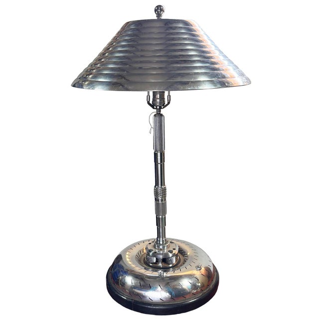 Sculptural 1980s table lamp executed in a bold Machine Age, Art Deco–inspired design, featuring a polished chrome finish...
