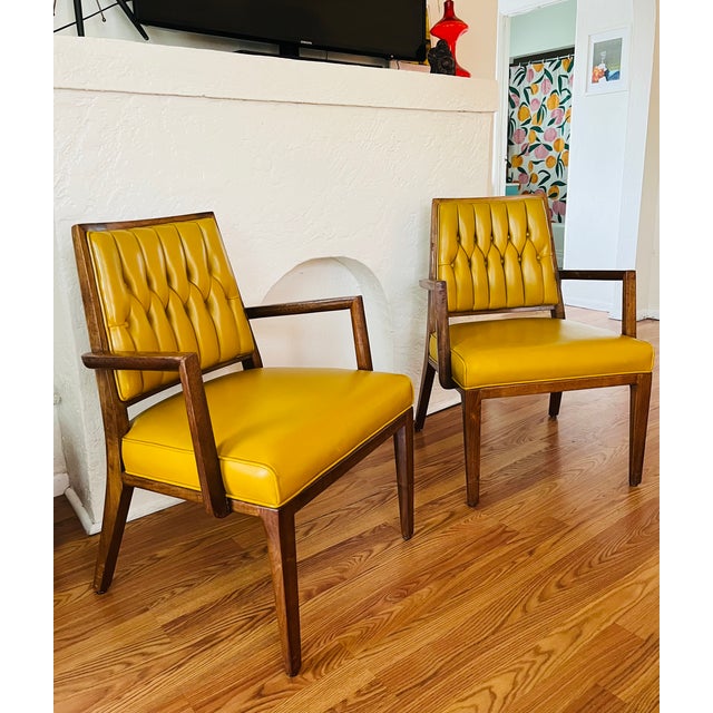 Pair of Monteverdi Young Vintage mid-century modern walnut armchairs designed by Maurice Bailey in 1969. These were...