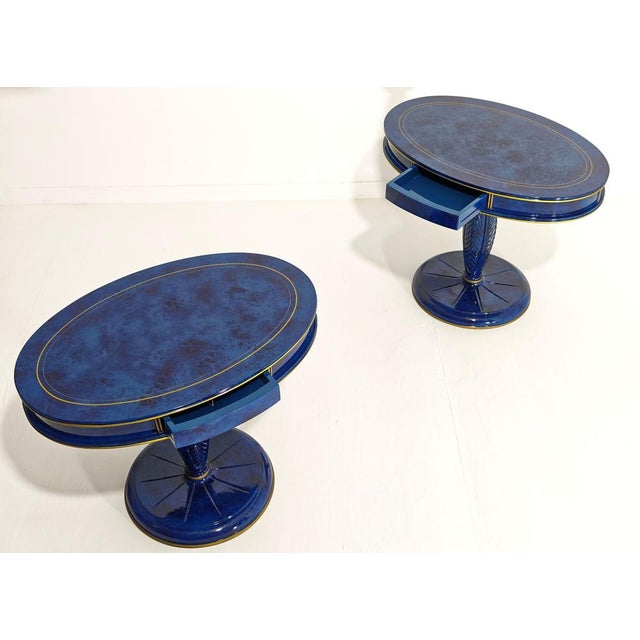 ANNIBALE COLOMBO. Made in Italy, circa 1980 Pair of bedside tables with wooden frames and a lapis lazuli-effect finish...