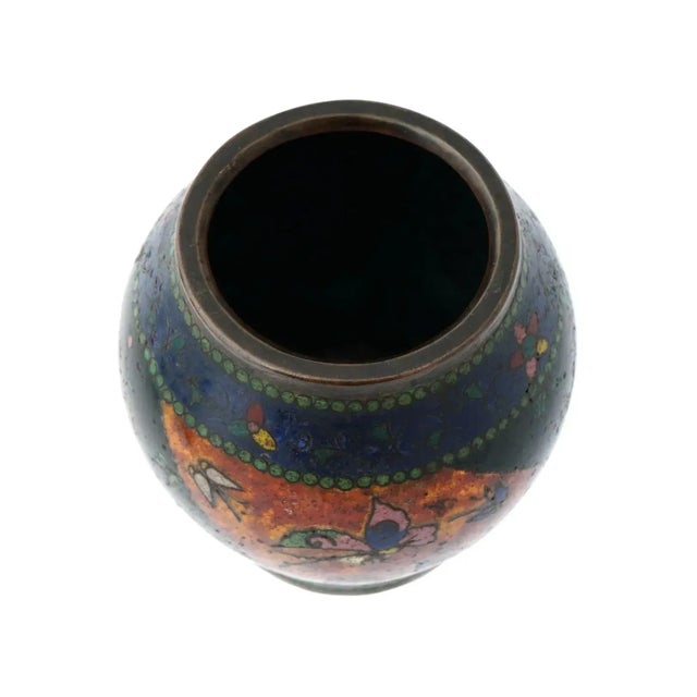 An antique Japanese, early Meiji era, enamel over gilt copper vase. The exterior of the ware is adorned with polychrome...