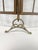 A refined highly unusual folding fire screen or hearth guard constructed in brass with two hinged leaves that open outward...