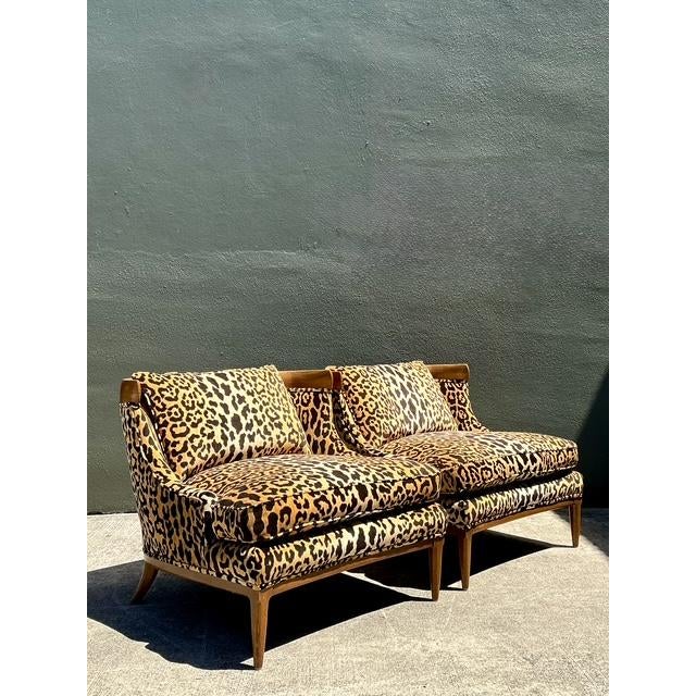 Make a sophisticated statement with this striking pair of Mid-Century Modern slope arm lounge chairs. Exuding a chic...