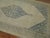An authentic early 20th century Persian Serab gallery rug with a large soft blue central medallion set on a khaki field....