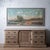 A large panoramic landscape in oil on canvas, depicting a pastoral river valley with a winding waterway, clustered village...