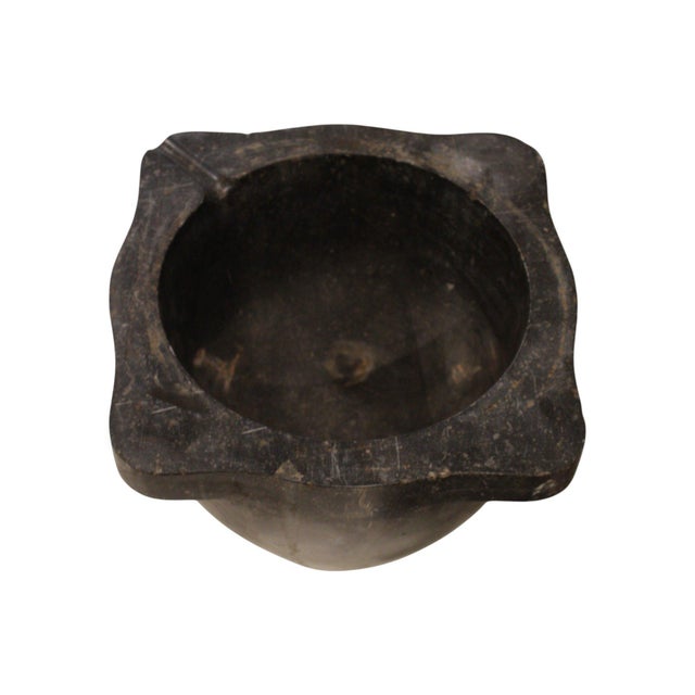 This 19th-century French antique black stone mortar bowl is carved from solid stone with a smooth, time-worn surface. The...