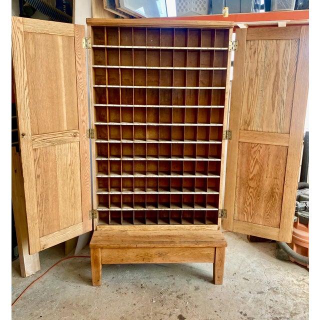 Authentic antique American postal sorting cabinet in solid oak, dating to the early 20th century. This piece was...