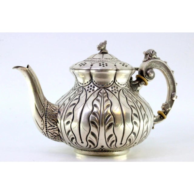 Silver Kettle with Relief Engraving and Handle Lid with Dragon Figure, in Very Good conditions. Designed 1890 to 1919 This...